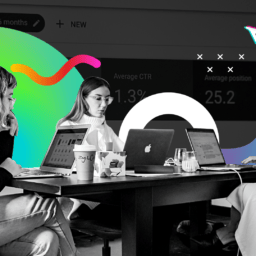 Professional marketers sitting around a table working on paid search tasks