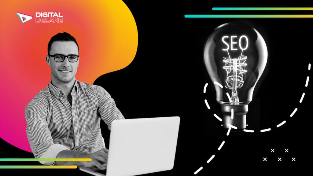 Man smiling and working on his laptop doing SEO work