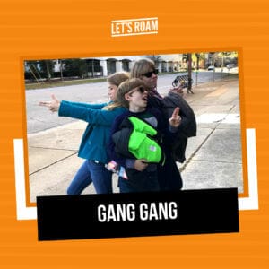 A mom and her two kids doing a funny pose using the Let's Roam app