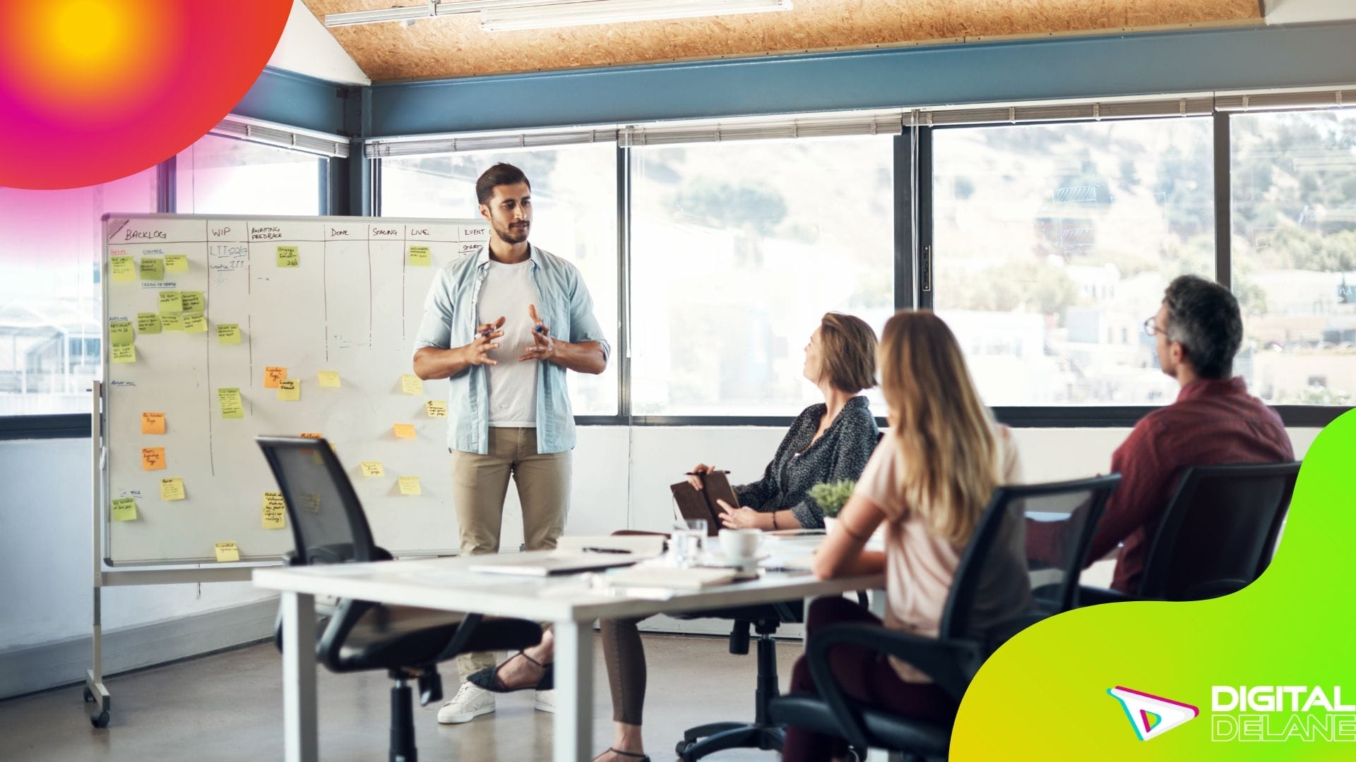 A diverse group of professionals engaged in an office meeting discussing digital marketing services.