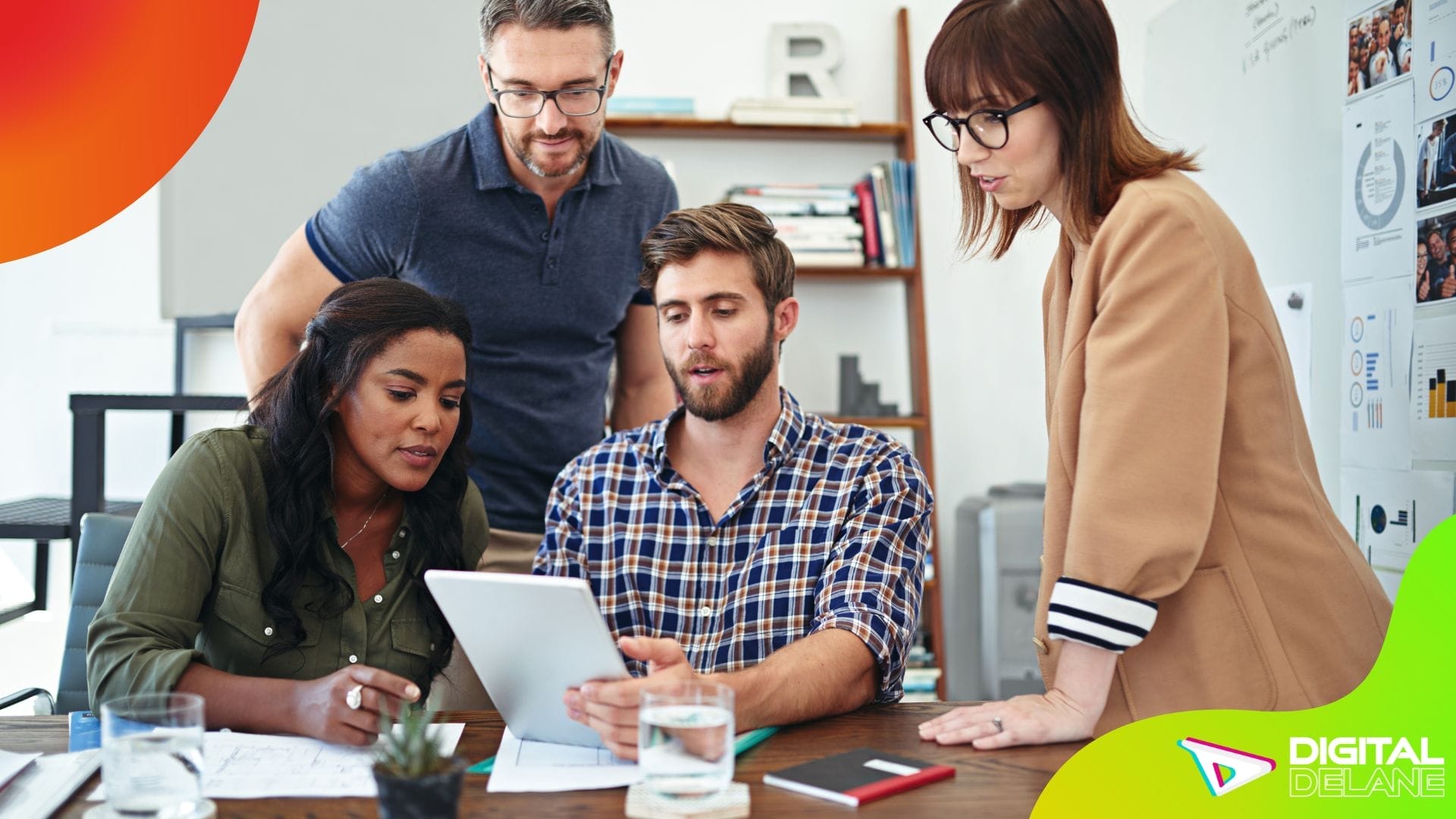 A diverse team collaborates on a tablet, strategizing to enhance user experience and drive website conversions effectively.