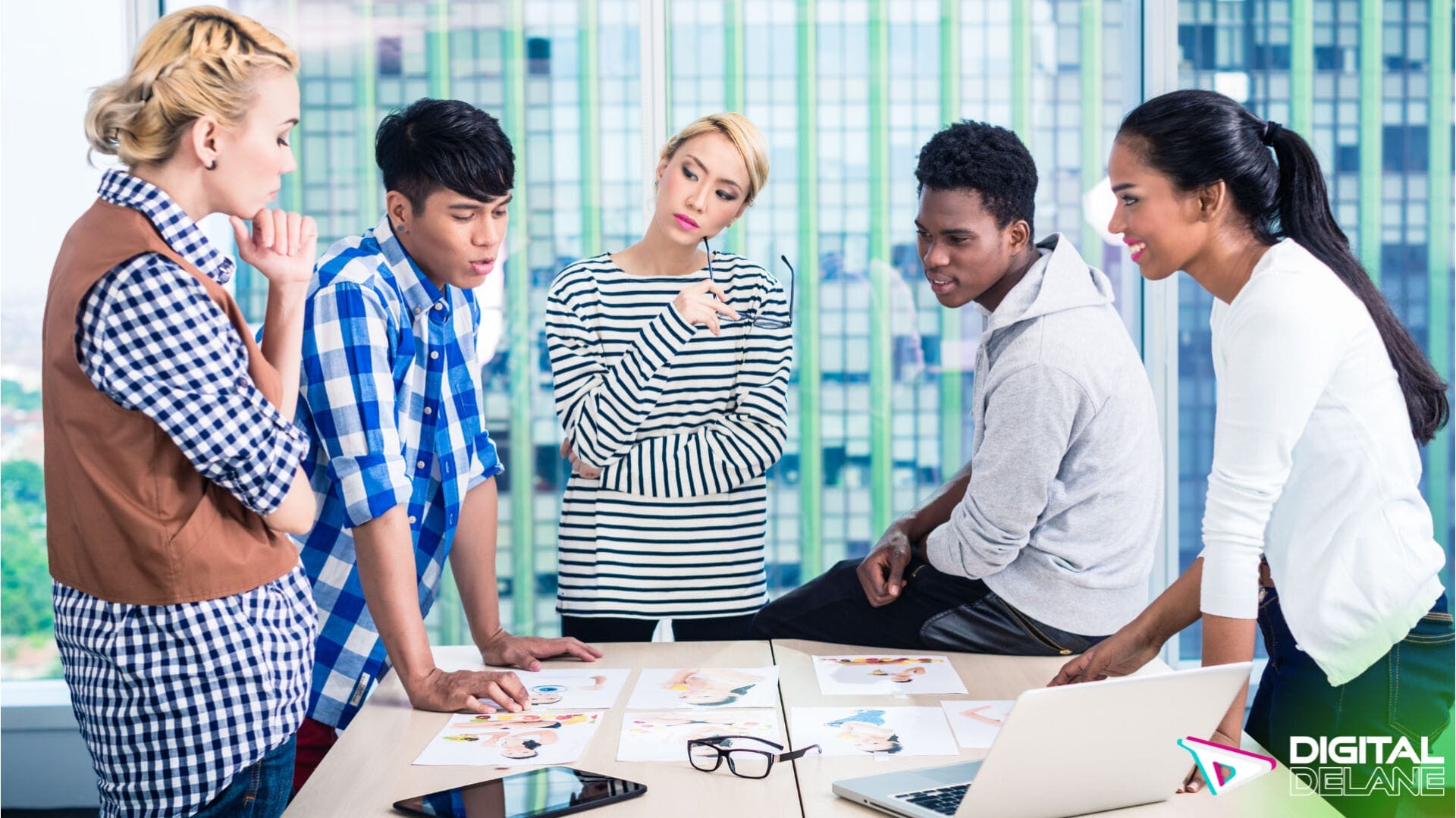 A group of professionals collaborating around a table with a laptop, discussing digital marketing strategies and programmatic advertising.