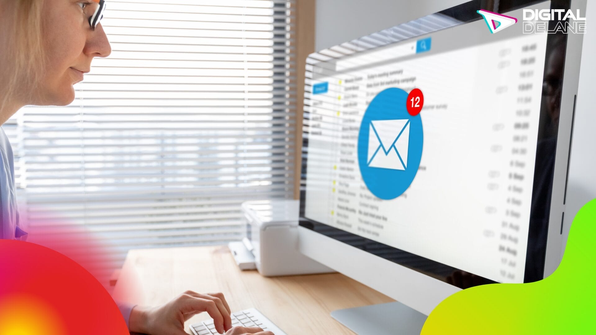 A woman types on a computer, with an email icon displayed on the screen, embodying modern email marketing design trends.