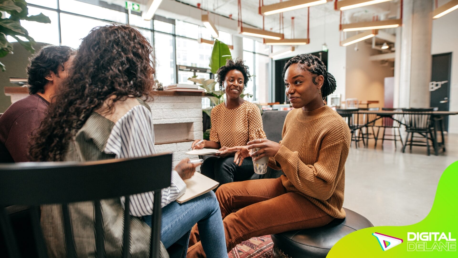 Three women engaged in conversation at a coffee shop, fostering community connections and networking opportunities.