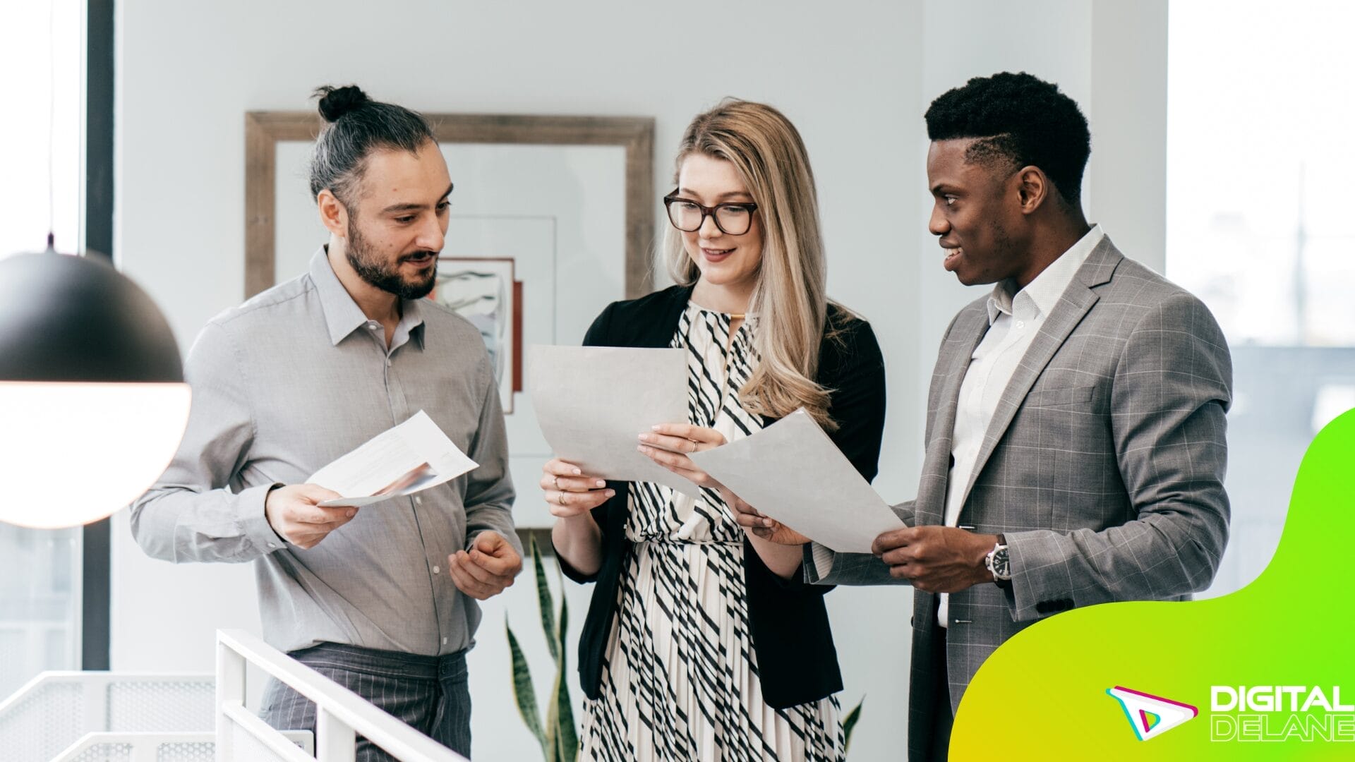 Three business professionals discussing digital marketing services, focusing on strategies to engage and retain mobile users.