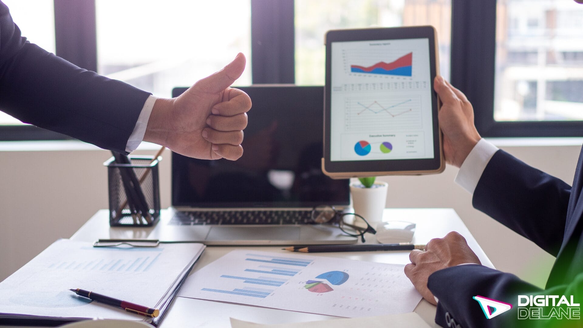 Two business professionals displaying a tablet computer, symbolizing enhanced user engagement and accessibility in digital content.