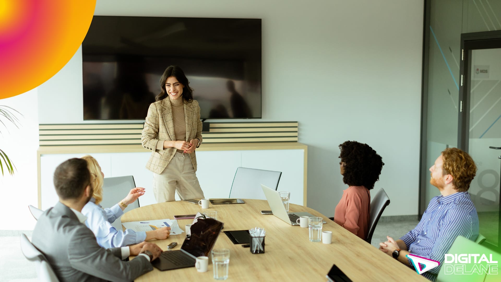 A woman presents in a conference room, showcasing strategic planning and execution for impactful business campaigns.