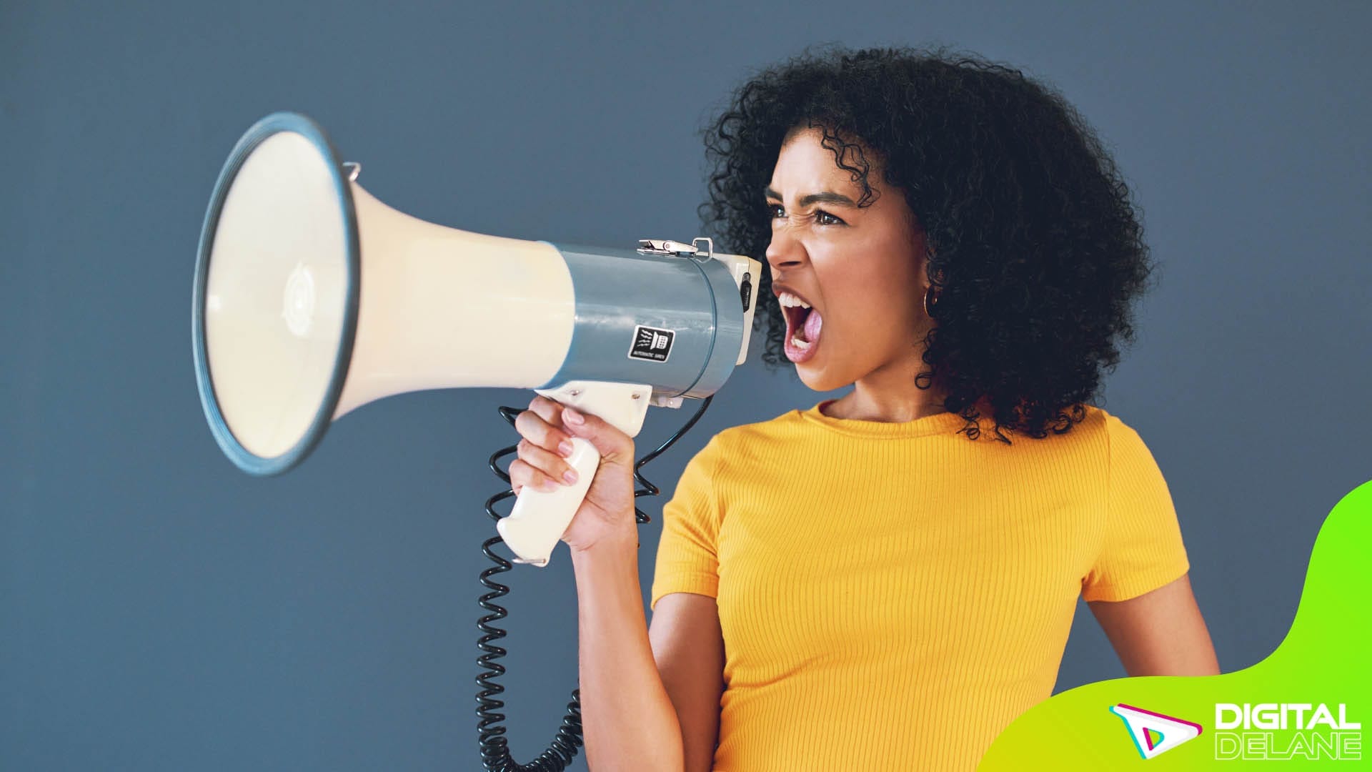 A woman passionately shouting into a megaphone, symbolizing a strong and assertive brand voice.