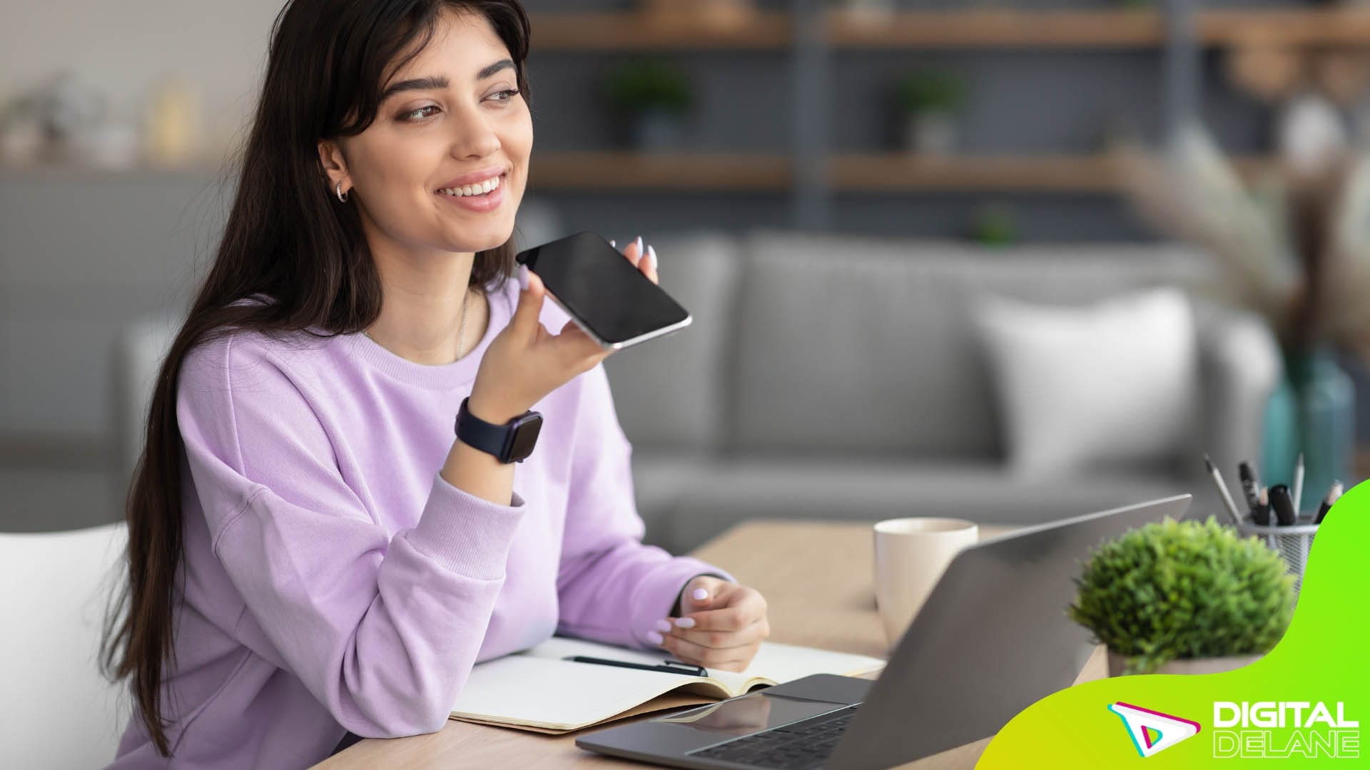 A woman smiles while holding a laptop and a credit card, embodying the essence of modern online shopping and digital engagement.
