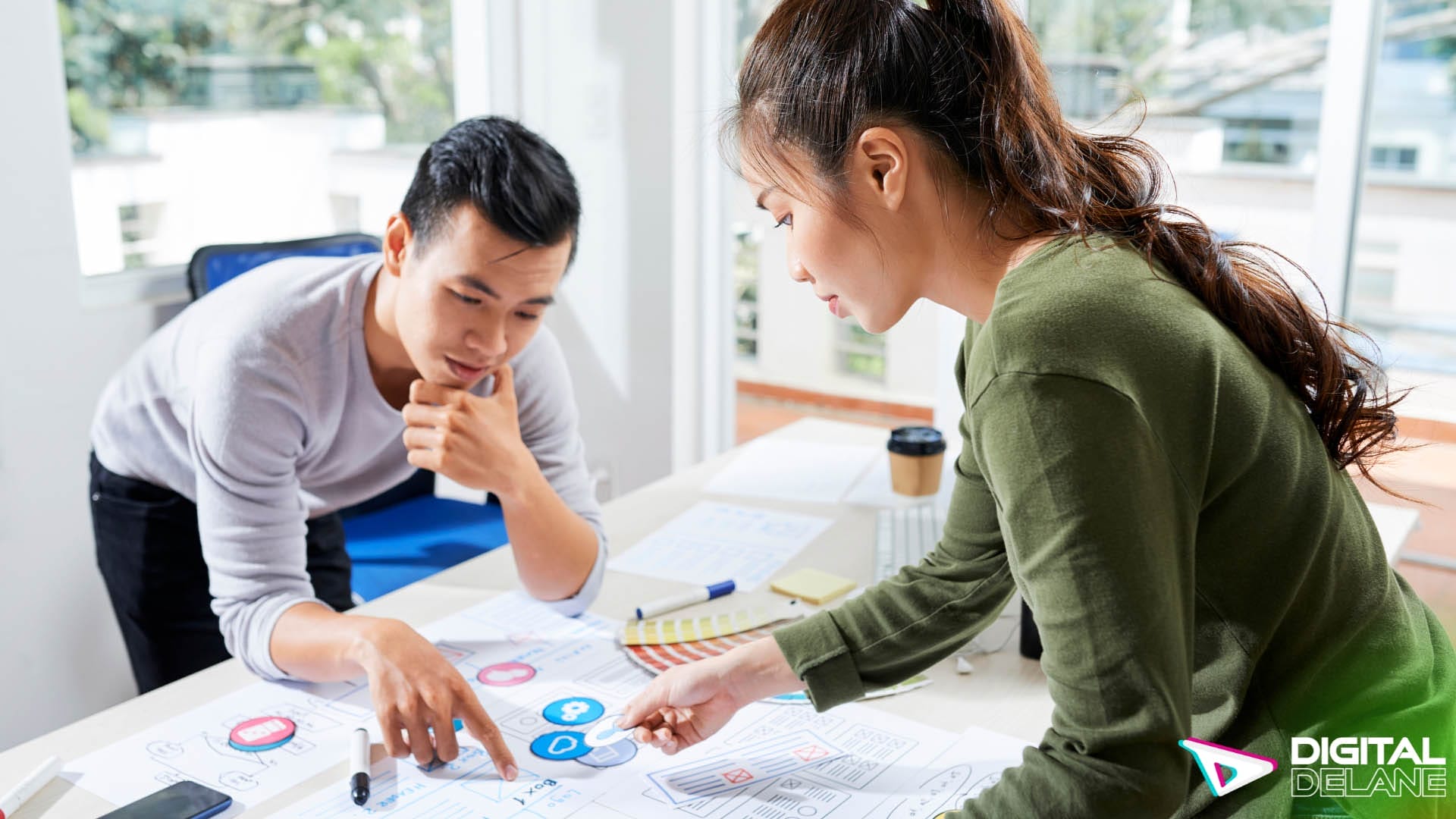 A man and woman collaborate on a project focused on enhancing community planning and customer interactions.
